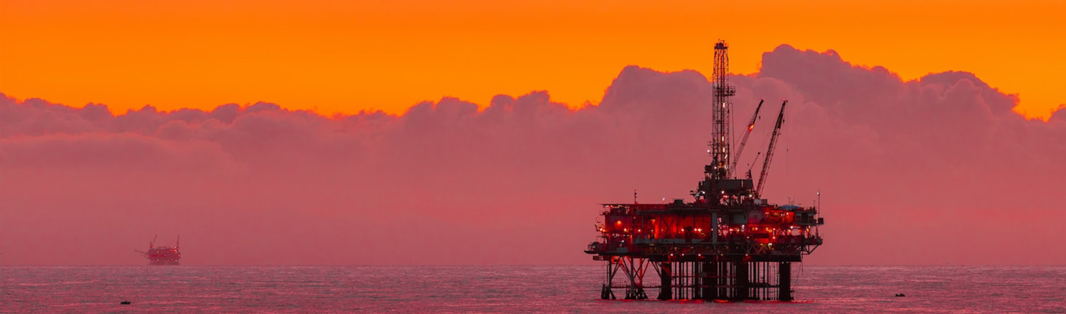 sunset over oil platform